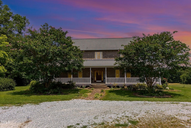 1770 Gentry Ridge Rd, Roxboro, NC 27574 - view of front of home with brick siding, covered porch, and a front yard