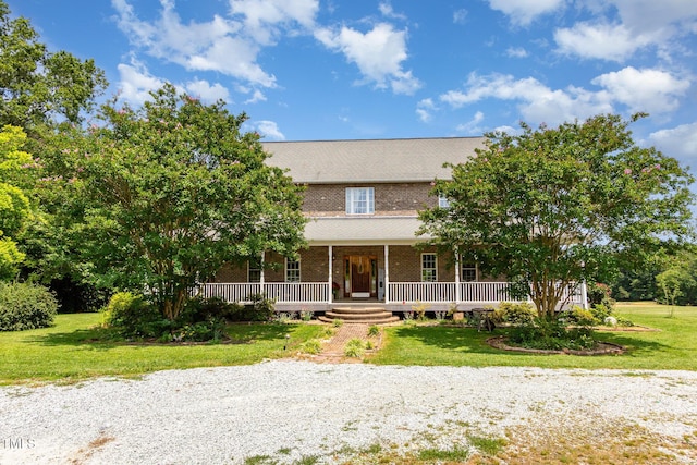 1770 Gentry Ridge Rd, Roxboro, NC 27574 - view of front of house with brick siding, covered porch, and a front lawn