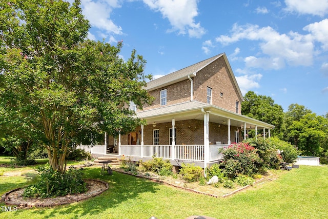 1770 Gentry Ridge Rd, Roxboro, NC 27574 - view of side of property featuring brick siding, covered porch, and a lawn