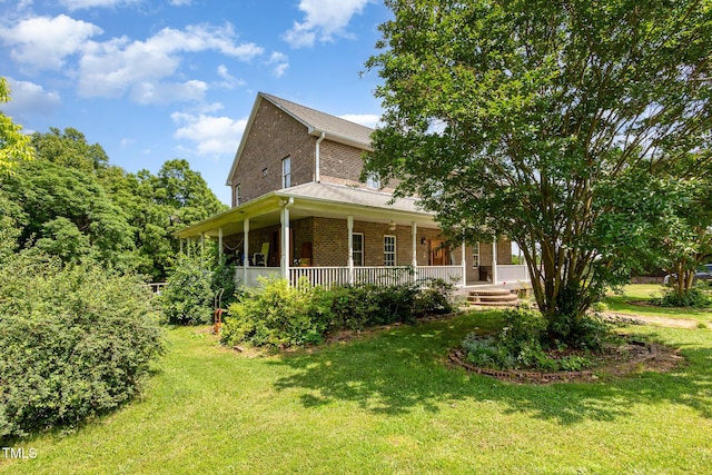 1770 Gentry Ridge Rd, Roxboro, NC 27574 - farmhouse featuring brick siding, covered porch, and a front lawn