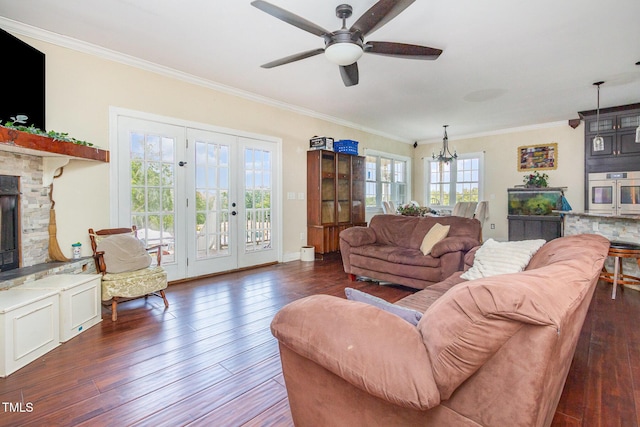 1770 Gentry Ridge Rd, Roxboro, NC 27574 - living room featuring hardwood / wood-style flooring, ceiling fan, crown molding, a fireplace, and a chandelier