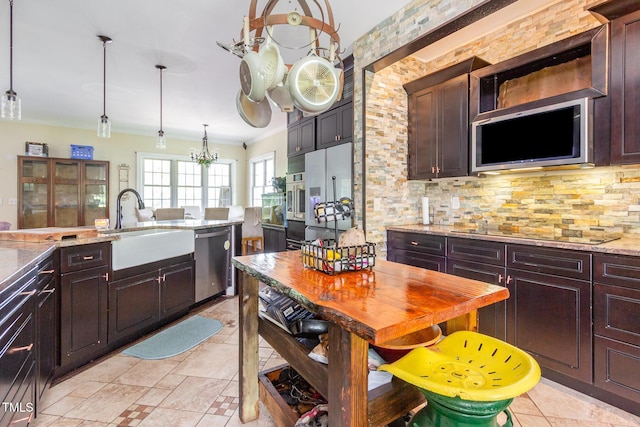 1770 Gentry Ridge Rd, Roxboro, NC 27574 - kitchen featuring stainless steel appliances, a sink, ornamental molding, tasteful backsplash, and dark brown cabinets