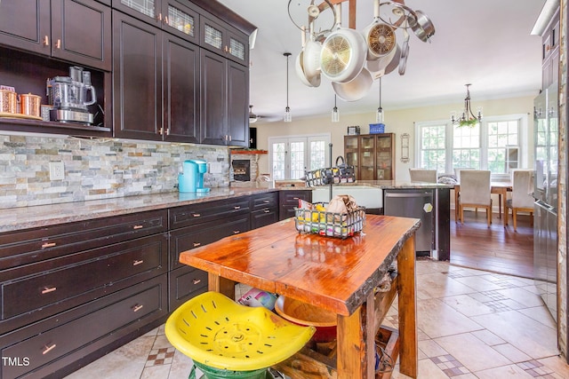 1770 Gentry Ridge Rd, Roxboro, NC 27574 - kitchen with dishwasher, a peninsula, tasteful backsplash, a sink, and a chandelier