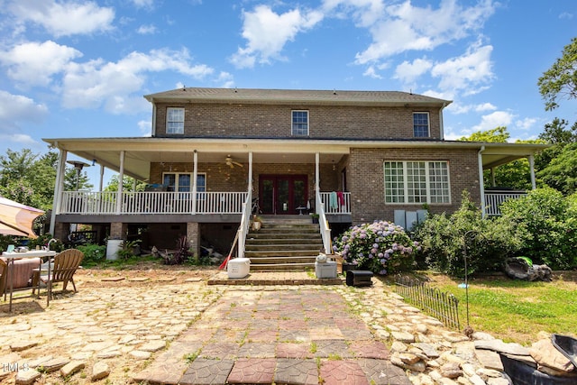 1770 Gentry Ridge Rd, Roxboro, NC 27574 - view of front of house with stairway, brick siding, a patio, and a deck