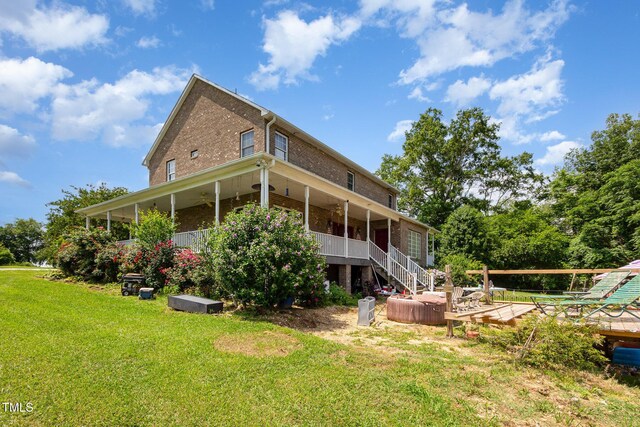 1770 Gentry Ridge Rd, Roxboro, NC 27574 - rear view of property featuring a yard, brick siding, a wooden deck, ceiling fan, and stairs