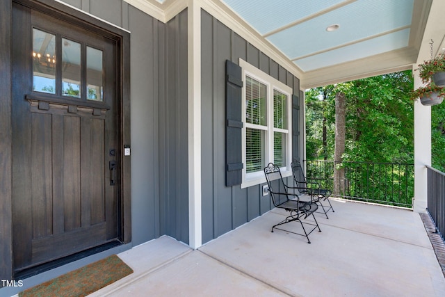 415 1st St, Apex, NC 27502 - view of exterior entry with a porch and board and batten siding