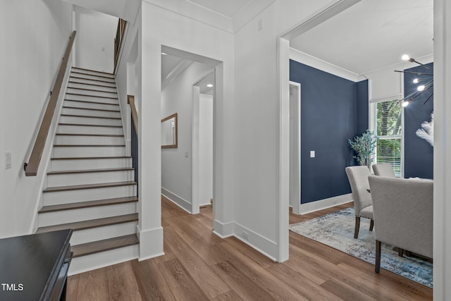 415 1st St, Apex, NC 27502 - staircase with ornamental molding, wood finished floors, and baseboards