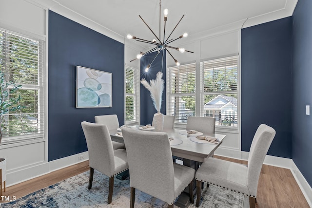 415 1st St, Apex, NC 27502 - dining area featuring a chandelier, wood finished floors, healthy amount of natural light, and baseboards