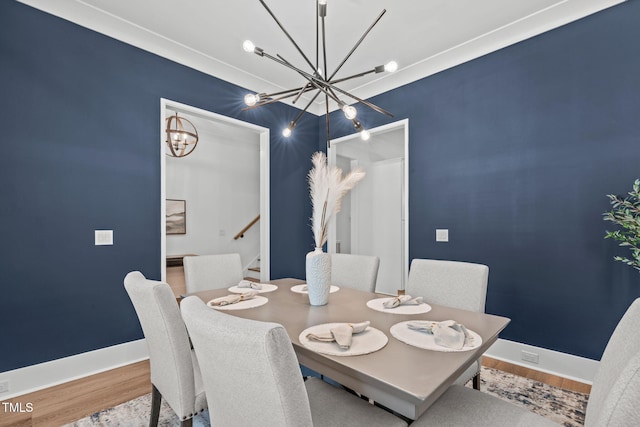 415 1st St, Apex, NC 27502 - dining space with a chandelier, wood finished floors, stairs, and baseboards