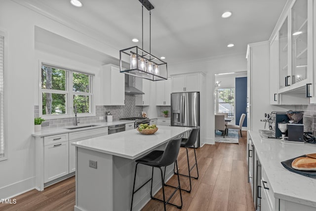 415 1st St, Apex, NC 27502 - kitchen with stainless steel appliances, a sink, white cabinets, dark wood-type flooring, and recessed lighting