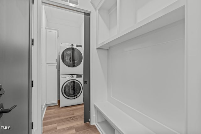 415 1st St, Apex, NC 27502 - laundry room with stacked washing machine and dryer and light wood-style flooring