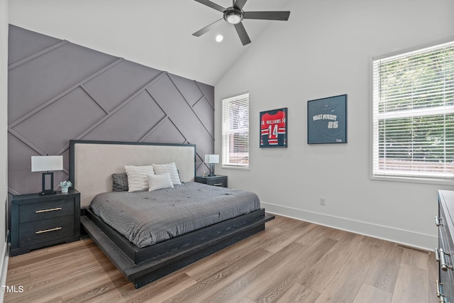 415 1st St, Apex, NC 27502 - bedroom featuring light wood finished floors, vaulted ceiling, baseboards, and ceiling fan