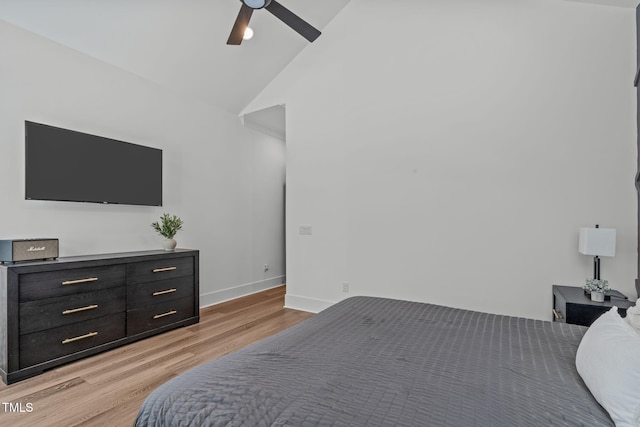 415 1st St, Apex, NC 27502 - bedroom featuring light wood-style floors, baseboards, vaulted ceiling, and a ceiling fan