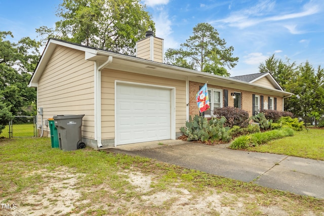 6424 Bretton Woods Dr, Hope Mills, NC 28348 - view of front of house featuring a chimney, a garage, asphalt driveway, and brick siding
