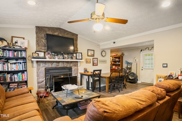 6424 Bretton Woods Dr, Hope Mills, NC 28348 - living area with wood finished floors, ceiling fan, a textured ceiling, a fireplace, and ornamental molding