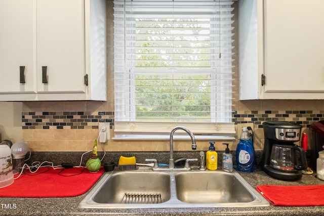 6424 Bretton Woods Dr, Hope Mills, NC 28348 - kitchen with a sink, white cabinetry, dark countertops, and backsplash