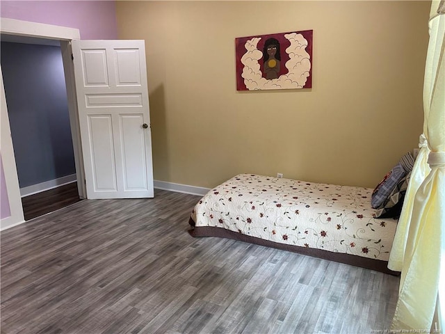 135 S Patterson S, Maxton, NC 28364 - bedroom with dark wood finished floors and baseboards