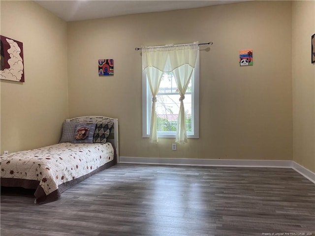 135 S Patterson S, Maxton, NC 28364 - bedroom with wood finished floors and baseboards