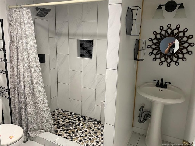 135 S Patterson S, Maxton, NC 28364 - full bathroom with a tile shower, toilet, and tile patterned floors