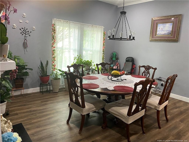 135 S Patterson S, Maxton, NC 28364 - dining area featuring wood finished floors, baseboards, a chandelier, and ornamental molding