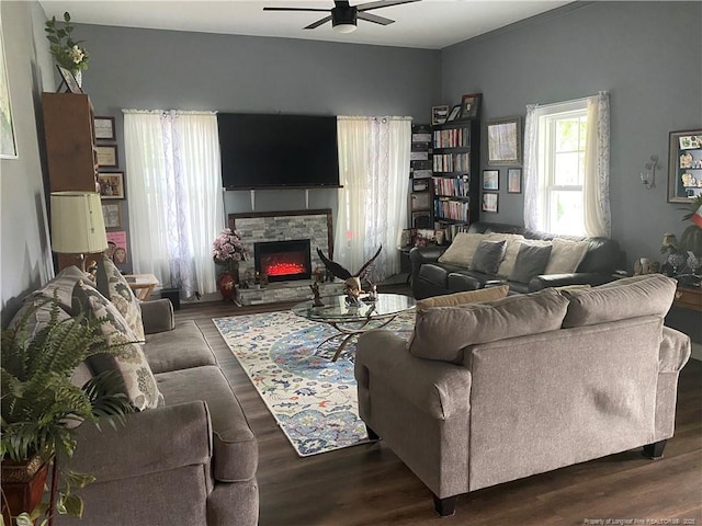 135 S Patterson S, Maxton, NC 28364 - living area with a ceiling fan, wood finished floors, and a stone fireplace