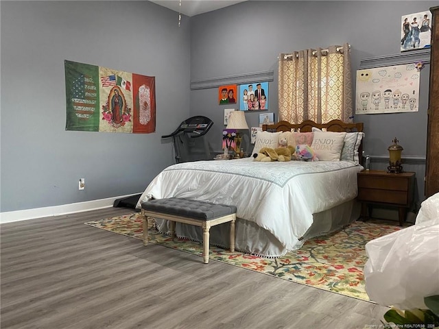 135 S Patterson S, Maxton, NC 28364 - bedroom featuring wood finished floors and baseboards