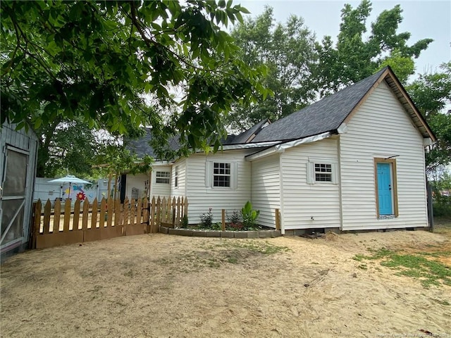 135 S Patterson S, Maxton, NC 28364 - rear view of house featuring a shingled roof