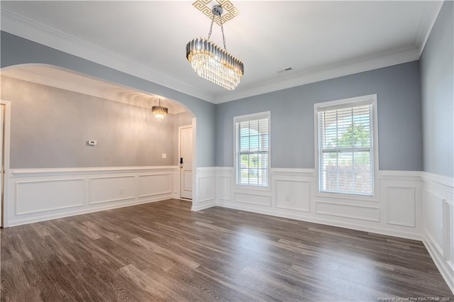 2912 Seafarer Dr, Fayetteville, NC 28306 - unfurnished room featuring arched walkways, a chandelier, wainscoting, dark wood-style flooring, and ornamental molding