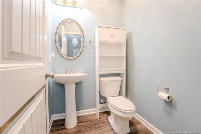 2912 Seafarer Dr, Fayetteville, NC 28306 - bathroom with toilet, wood finished floors, and baseboards