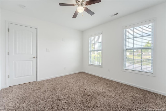 2912 Seafarer Dr, Fayetteville, NC 28306 - spare room with carpet, baseboards, ceiling fan, and a smoke detector