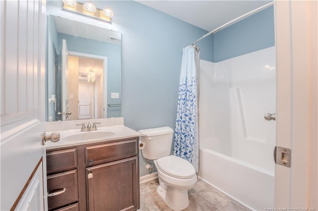 2912 Seafarer Dr, Fayetteville, NC 28306 - full bathroom with toilet, vanity, shower / bathtub combination with curtain, and baseboards