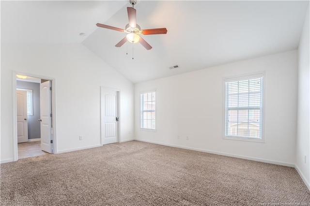 2912 Seafarer Dr, Fayetteville, NC 28306 - unfurnished bedroom with light carpet, vaulted ceiling, baseboards, and connected bathroom