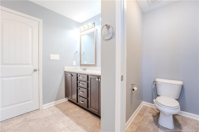2912 Seafarer Dr, Fayetteville, NC 28306 - bathroom with vanity, toilet, and baseboards