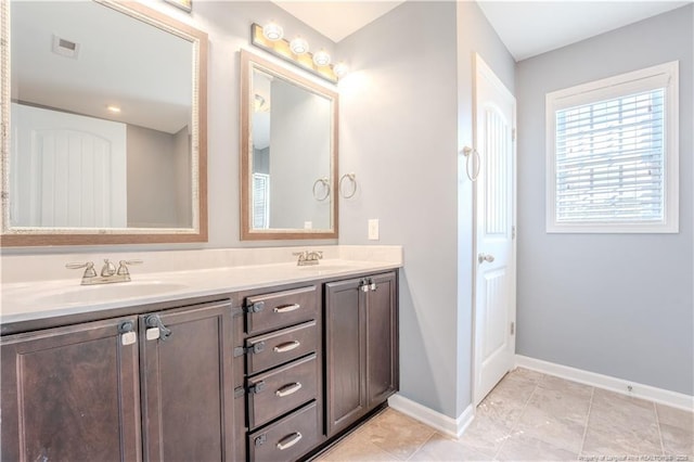 2912 Seafarer Dr, Fayetteville, NC 28306 - full bathroom with double vanity and baseboards