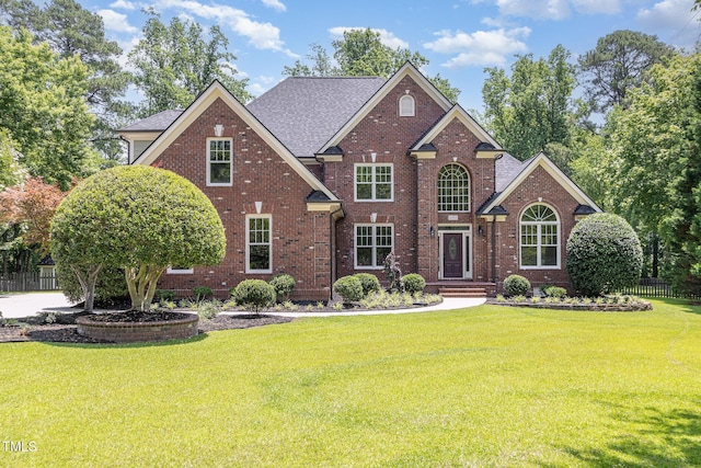 6553 Vintage Ridge Ln, Fuquay Varina, NC 27526 - view of front of house featuring brick siding and roof with shingles