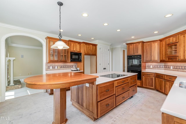 6553 Vintage Ridge Ln, Fuquay Varina, NC 27526 - kitchen with black appliances, light tile patterned flooring, brown cabinetry, decorative backsplash, and recessed lighting