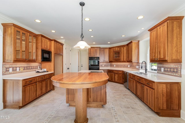 6553 Vintage Ridge Ln, Fuquay Varina, NC 27526 - kitchen featuring a sink, recessed lighting, black appliances, brown cabinetry, and tasteful backsplash