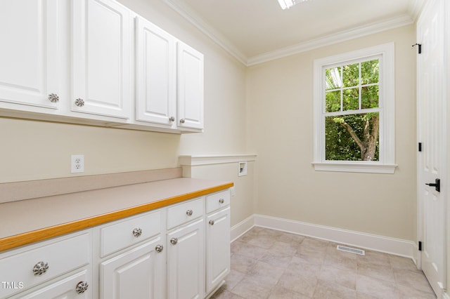 6553 Vintage Ridge Ln, Fuquay Varina, NC 27526 - laundry area with cabinet space, crown molding, hookup for a washing machine, baseboards, and light tile patterned floors