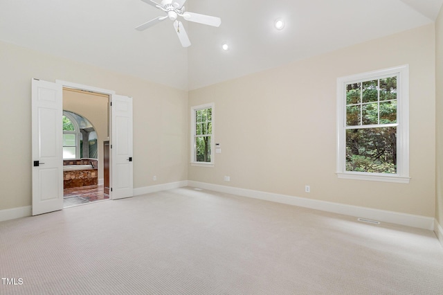 6553 Vintage Ridge Ln, Fuquay Varina, NC 27526 - unfurnished room featuring light colored carpet, plenty of natural light, baseboards, a ceiling fan, and high vaulted ceiling