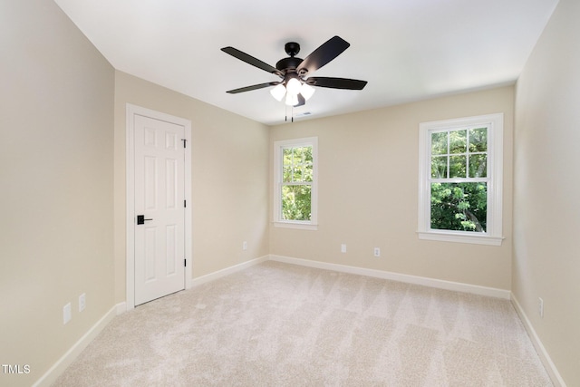 6553 Vintage Ridge Ln, Fuquay Varina, NC 27526 - unfurnished room featuring light carpet, plenty of natural light, and a ceiling fan