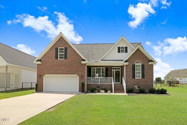 103 Kayla Marie Ln, Goldsboro, NC 27530 - traditional-style house featuring covered porch, brick siding, an attached garage, and driveway
