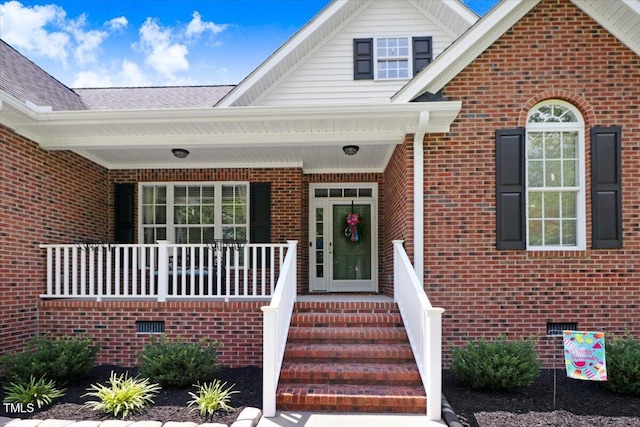 103 Kayla Marie Ln, Goldsboro, NC 27530 - property entrance featuring brick siding, a porch, and crawl space