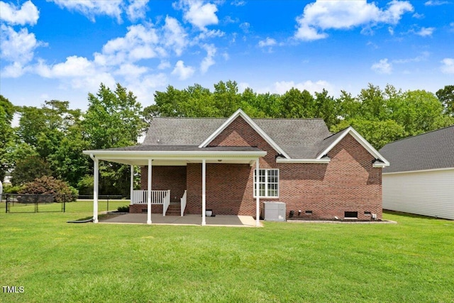 103 Kayla Marie Ln, Goldsboro, NC 27530 - back of property featuring a patio, brick siding, crawl space, and central AC unit