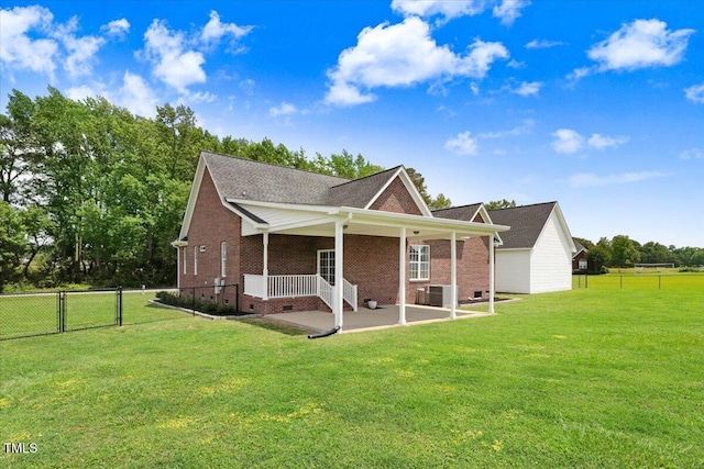 103 Kayla Marie Ln, Goldsboro, NC 27530 - rear view of house featuring a gate, crawl space, a patio, brick siding, and central AC