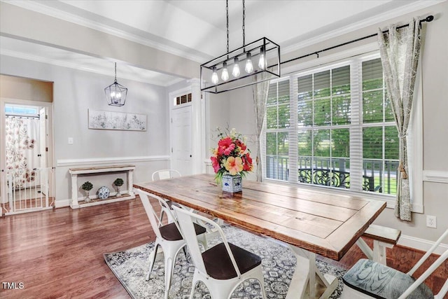103 Kayla Marie Ln, Goldsboro, NC 27530 - dining room featuring plenty of natural light, a chandelier, ornamental molding, wood finished floors, and baseboards