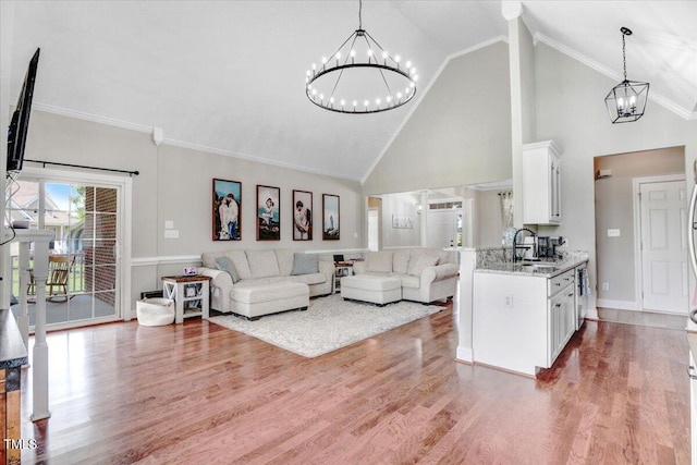 103 Kayla Marie Ln, Goldsboro, NC 27530 - living area with a chandelier, wood finished floors, high vaulted ceiling, and ornamental molding