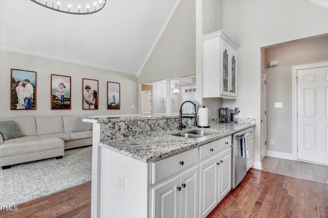 103 Kayla Marie Ln, Goldsboro, NC 27530 - kitchen featuring a sink, dishwasher, light stone countertops, white cabinets, and dark wood-style floors