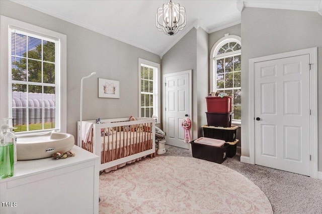 103 Kayla Marie Ln, Goldsboro, NC 27530 - carpeted bedroom featuring crown molding, a chandelier, a nursery area, vaulted ceiling, and baseboards