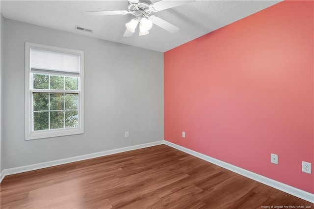 4420 Battle Forest Rd, Hope Mills, NC 28348 - unfurnished room featuring wood finished floors, a ceiling fan, and baseboards
