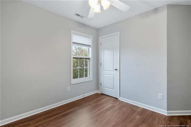 4420 Battle Forest Rd, Hope Mills, NC 28348 - spare room featuring wood finished floors, baseboards, and a ceiling fan
